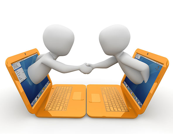 two people coming out of laptop screens shaking hands